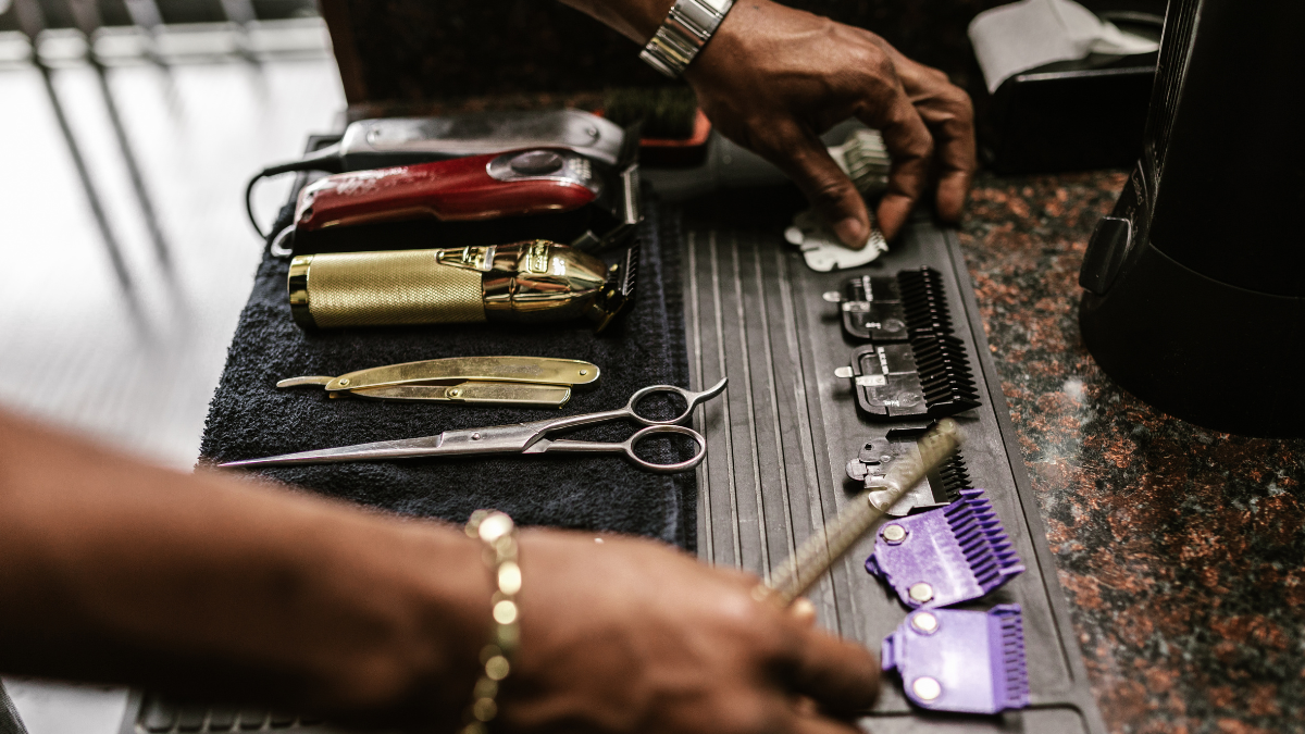 A barber sorts through his favorite tools and products, all things he'll put on his gift guide as part of his holiday promotions.