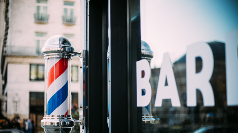 In this image is a barbershop that a barber is considering moving to a new location.